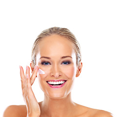 Image showing Woman, portrait and apply creme in studio, cosmetics and luxury skincare lotion on white background. Happy female person, moisturizer and hydrate for smooth or clear skin, beauty and facial treatment