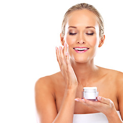 Image showing Woman, moisturizer and skincare cream in studio or health treatment as product, wellness or white background. Female person, finger and face lotion or dermatology self care, mockup space or sunscreen