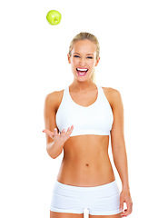 Image showing Woman, portrait and apple in studio for diet nutrition on white background, lose weight or training. Female person, smile and fruit snack with mockup space or health benefit as progress, goal or meal