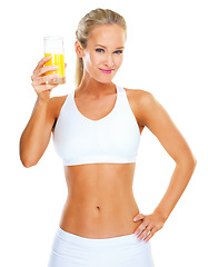 Image showing Woman, portrait and glass of juice in studio, fitness and vitamin c liquid on white background. Female person, smile and drink or smoothie for weight loss, organic diet and citrus detox for minerals