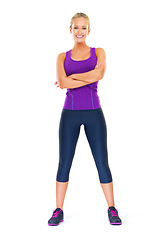 Image showing Portrait, confident and woman in studio for exercise or fitness with mockup space, happiness and sportswear for workout. Female person, isolated and white background for training or cardio for health