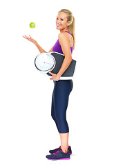 Image showing Portrait, scale and apple with woman, fitness and nutrition isolated on a white studio background. Full body, person or model with weight loss or fruit for wellness or healthy with diet plan or smile