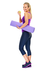 Image showing Woman, portrait and apple with yoga mat in studio, smile and pilates for fitness on white background. Female person, happy and fruit for minerals or vitamins, wellness and healthy diet for fiber