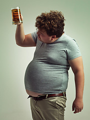 Image showing Plus size, man and checking beer for unhealthy, habit and weight gain in studio of white background. Beverage, decision and male person with drink in hand for stomach, calories and carbs by mockup