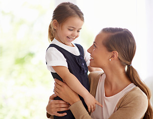 Image showing Smile, mother and young girl at home bonding, love and embracing in backyard. Happy, family and nurturing with hug and affection, hold and parent with daughter while sharing moment for mothers day