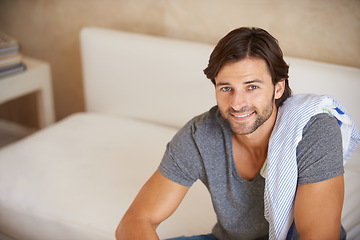 Image showing Portrait, man or smile to relax in fashion, apparel or casual outfit on sofa in lounge in Turkey. Male designer, happy or couch as look, rest or satisfaction of stylish comfortable weekend break