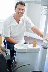 Image showing Portrait male dentist and man with smile, equipment and medical service with schedule and professional. Face, person and oral health with employee and appointment with tools, happy and dental care