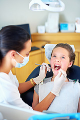 Image showing Girl, child and woman at dentist for healthcare with dental tool, consultation and mouth inspection for oral health. Orthodontics, kid patient or gloves for teeth cleaning, gingivitis or medical care