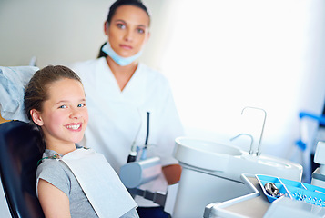 Image showing Dentist, clinic and portrait of child with smile for cleaning, teeth whitening and wellness. Healthcare, dentistry and woman and girl with tools for dental hygiene, oral care and medical services