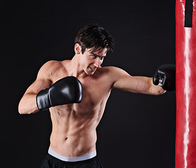 Image showing Man, punching bag and martial arts with fitness, training and fighter with gloves and wellness with cardio. Boxer, practice and athlete with exercise and workout with endurance, health and progress