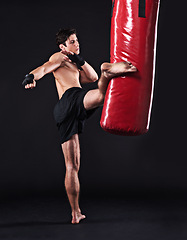 Image showing Kickboxing, challenge and man with training, fitness and exercise on a dark studio background. Healthy person, mockup space and model with endurance and progress with workout and wellness with cardio