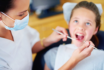 Image showing Woman, dentist and child for cleaning teeth or consultation appointment for cavity health, whitening or examination. Female person, girl and mouth for oral hygiene or gum diagnosis, equipment or care