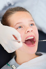 Image showing Girl, child and mouth inspection at dentist for healthcare with dental tool, consultation or checkup for oral health. Expert, kid patient and glove hand for teeth cleaning, gingivitis or medical care