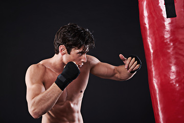 Image showing Man, punching bag and cardio with fitness, training and fighter with gloves and wellness with endurance. Boxer, balance and athlete with exercise and workout with sports, healthy guy and progress