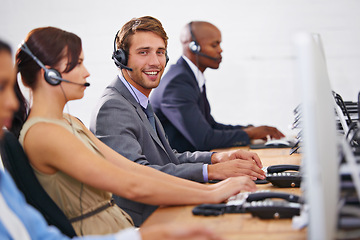 Image showing Man, portrait and coworking at call center with computer for tech support, help desk and customer service agency. Telecom, CRM and consultant for telemarketing, contact us and advice at workplace