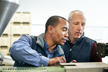 Image showing Factory, machine and coworkers in work conversation, maintenance for industrial safety and diversity employee together. Mechanical engineering, production monitoring system or inspection in warehouse