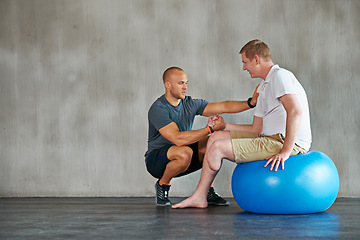 Image showing Physical therapy, gym help and exercise ball with a man with a disability and physio consultation for rehabilitation. Physiotherapy and healthcare professional with helping and wellness for mobility