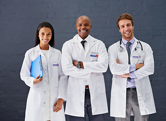 Image showing Doctors, coat and portrait for hospital healthcare service, medical treatment and wellness for professional care. Expert, nurse or specialist team and smile for support, cardiology and medicine