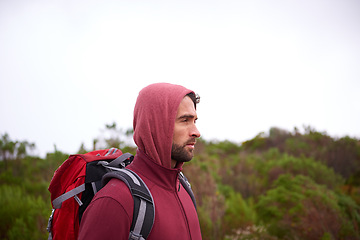 Image showing Man, trekking and mountain with bag in nature, Germany nature trail in conservation scenic area. Active, male person on adventure in health and wellness, confident explorer on rocky terrain for sport