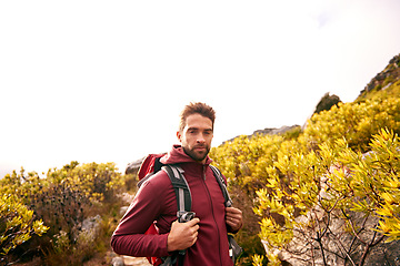 Image showing Confidence, hiking and portrait of man on mountain, nature and forest for outdoor adventure. Male person, athlete and sport in environment for exercise, fitness and health with backpack by landscape