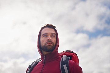 Image showing Sky, thinking and man with backpack, hiking or camping in nature for adventure and peace. Contemplation, vacation and male person in trip, thoughtful and journey for holiday and break to relax