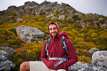 Image showing Hiking, portrait and man on mountain, nature and rock for outdoor adventure with happiness. Male person, athlete and sport in environment for exercise, fitness and health with backpack by landscape