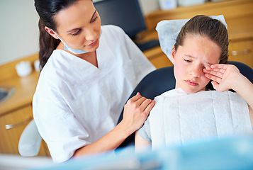 Image showing Dental, fear or crying girl with dentist in toothache consultation, problem or crisis. Pediatric dentistry, comfort or kid with stress, anxiety or tears for root canal, crown or extraction phobia