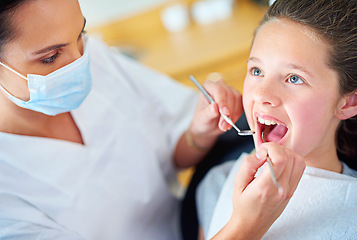 Image showing Woman, dentist and child for healthy teeth or consultation appointment for dental cavity, whitening or examination. Female person, face mask and oral hygiene for gum diagnosis, equipment or tooth