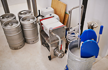 Image showing Brewery, tank and assembly line with machine for production for manufacturing process, distillation and beer in keg. Industrial industry, closeup and brewing drum in factory, warehouse or distillery