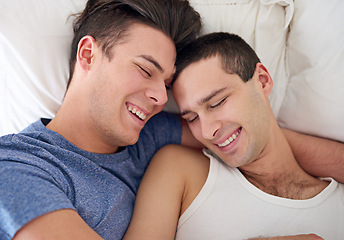 Image showing Men, gay and happy couple or bed embrace in apartment resting for lgbt pride with relax love, partner or connection. Male person, queer and smile with bonding support in home together, calm or peace