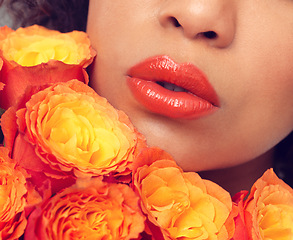 Image showing Lips, macro and woman with flowers, plants and bouquet for fragrance, scent and makeup for sustainable cosmetics. Girl, rose and mouth for beauty with eco friendly, floral and organic skin care