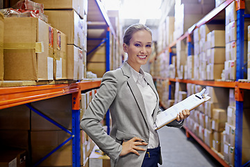 Image showing Businesswoman, warehouse and clipboard in portrait for management of logistics, shipping or packaging process. Girl, factory and products in storage for retail, delivery or distribution to store