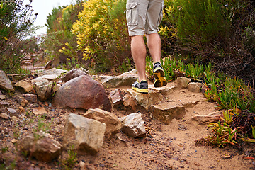 Image showing Person, shoes and legs for hiking, exercise and fitness for travel and adventure on vacation. Workout, trekking and training for relax and wellness on ground with rock for outdoor freedom in nature