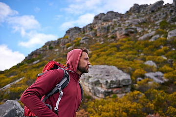 Image showing Man, hiking and workout in outdoor nature, mountain and peace or calm on rocks for wellness. Male person, exercise and travel with backpack on vacation, adventure and explore for fitness or trekking