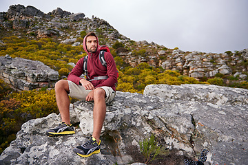 Image showing Man, mountains and view with thinking, travel and hiking for fitness and fresh air with backpacking outdoor. Calm, peace and wellness in nature, trekking and adventure for exploring with mindfulness