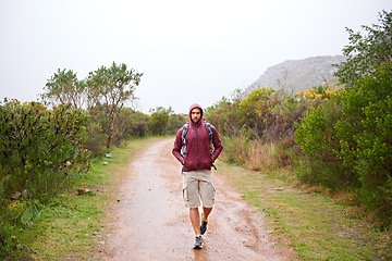 Image showing Man, walking and mountain with fitness in nature, Germany trail on wildlife conservation. Active, male person on adventure for health and wellness, confident explorer on backpacking for outdoor sport