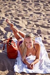 Image showing Woman, beach and sunbathing smile or relax summer on tropical island for Thailand holiday, sunshine or weekend. Female person, towel and handbag or tourist destination for adventure, calm or travel