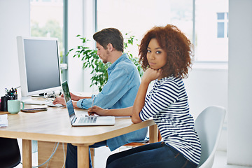 Image showing Portrait, African woman and coworking on laptop at desk in an office, internet and work project. Diverse people, workstation and technology screen in workplace with online, business and partnership