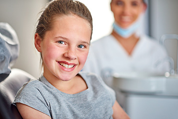 Image showing Young, girl and dental chair with smile, portrait and nurse for examination, healthcare and medicine. Female child, patient and dentist for braces, filling and cleaning for dentistry, care and health