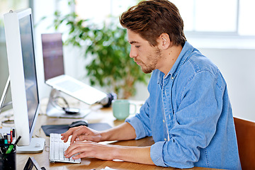 Image showing Office, employee and man with keyboard, computer and technology for job, networking and internet. Creative, male person and staff for remote, working and happiness for career as author on desk