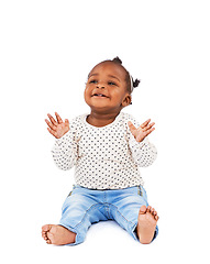 Image showing Baby, playing and clapping with smile in studio for applause, fun and cheerful on white background. Child, learning and motor skills for childhood development, excited and happy kid or infant