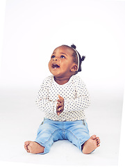 Image showing Black baby, girl or excited to relax, laugh or vision for clapping, funny or idea on white background. Toddler, smile or on floor to imagine, curiosity or wonder of childhood on studio mock up