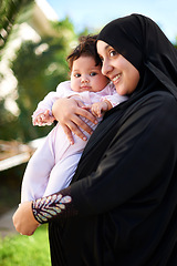 Image showing Muslim, woman and baby happy outdoor, hug in garden with mother and child for Eid celebration. Motherhood, family life and Islamic holiday with hijab, infant and smile in backyard for bonding