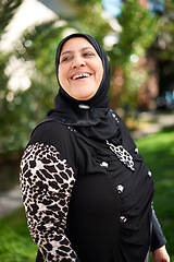 Image showing Mature woman, muslim and smile in garden at home for eid or ramadan for religion to enjoy and satisfied. Faith, Islam and happy for faith or hope with fasting on outfit for mosque, salvation and pray