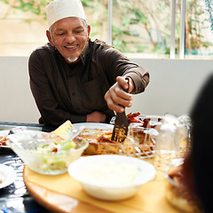 Image showing Senior man, muslim and table with food for eid or ramadan for religion to enjoy and satisfied at home. Faith, Islam and happy with meal or lunch from fasting on religious outfit with smile and joy