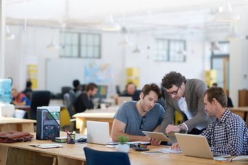 Image showing Businessman, office and discussion with teamwork on tablet for planning, research and ideas for company financial strategy. Professional, manager and staff by desk with digital technology for project