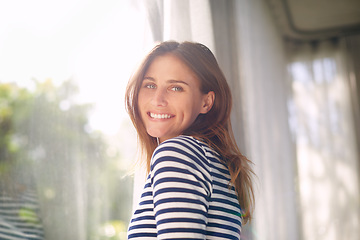 Image showing Woman, smile and portrait in house for relax and calm for holiday and cheerful on blurred background. Young person and happy with window for view of garden or backyard with sunlight in lounge