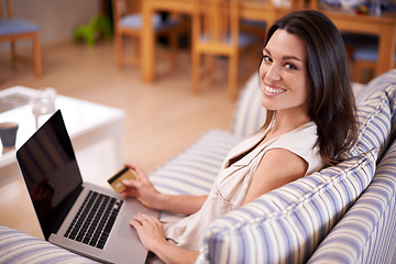 Image showing Portrait, woman and laptop with credit card for online shopping, ecommerce and fintech on sofa. Smile, female person and technology for application, digital payment and internet banking in apartment