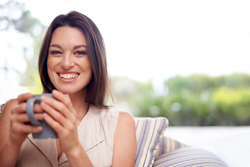 Image showing Woman, home and smile in couch with tea to relax or chill on break, day off and enjoy. Portrait, female person and happy in living room on sofa with cup of coffee for rest and calm in lounge.