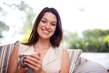 Image showing Woman, home and happy in couch with tea to relax or chill on break, day off and enjoy. Portrait, female person and smile in living room on sofa with cup of coffee for peace and calm in lounge.